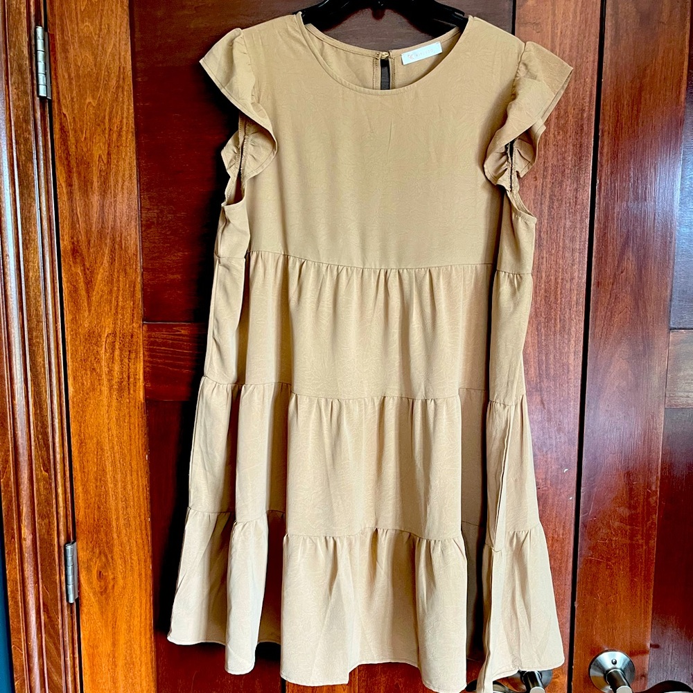 Beautiful tan baby doll dress. Size l